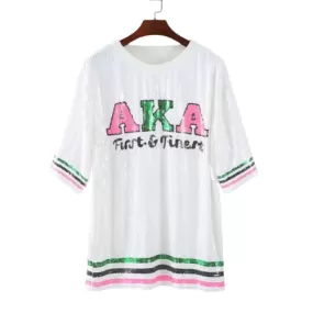 Alpha Kappa Alpha sorority sequence dress in white, featuring a large graphic AKA symbol.